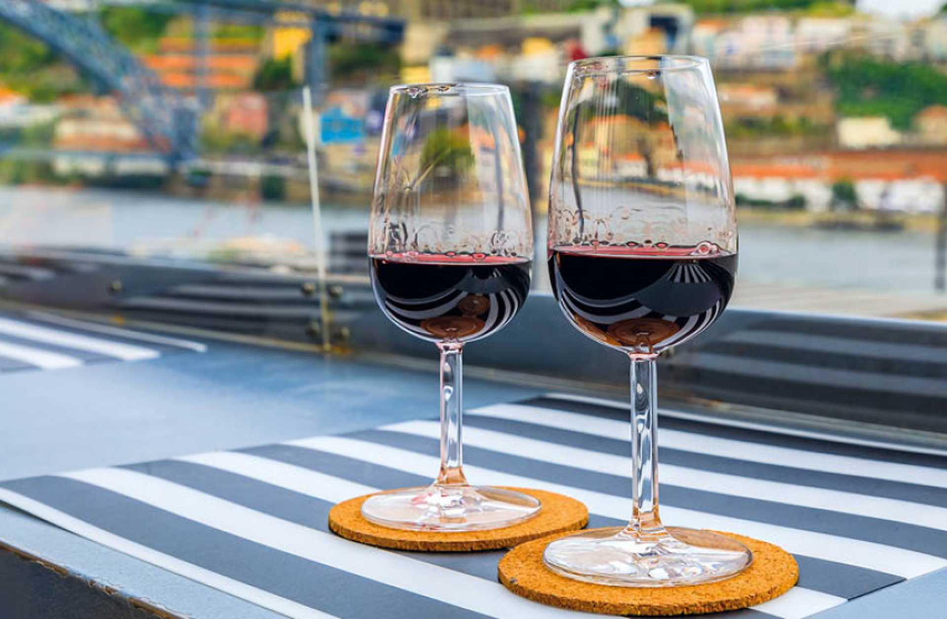 Two glasses of port wine served on the sun deck of a Douro river cruise ship