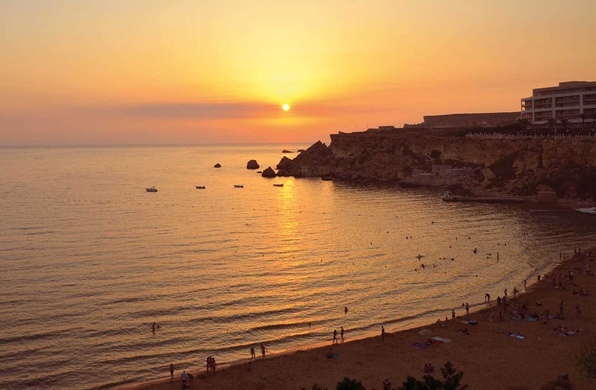 Sunset over Golden Bay, a sandy beach in Malta