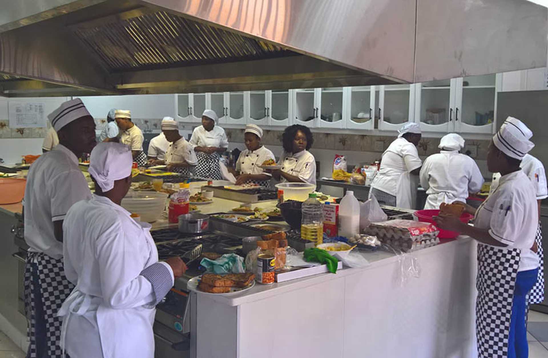 Cookery students in the kitchens at Mala Mala, South Africa