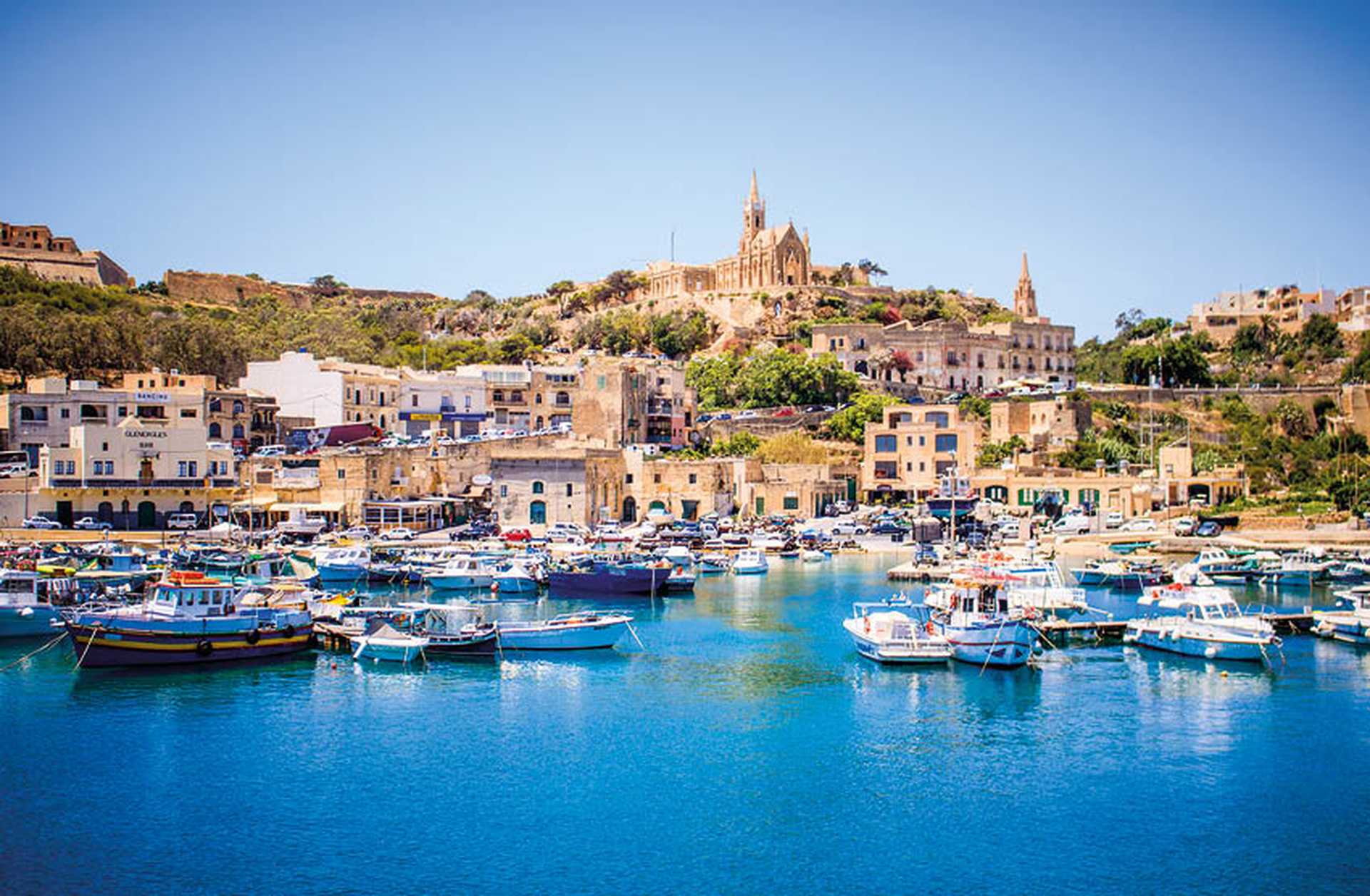 Approaching the harbour on Gozo by boat - enjoy a day trip during Titan's tour of Malta