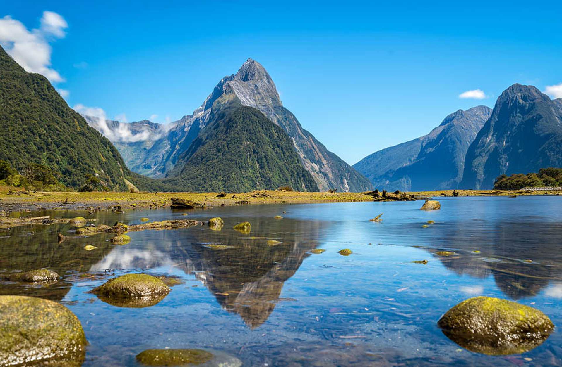 Looking across the waters of Milford Sound towards Mitre Peak, South Island, New Zealand