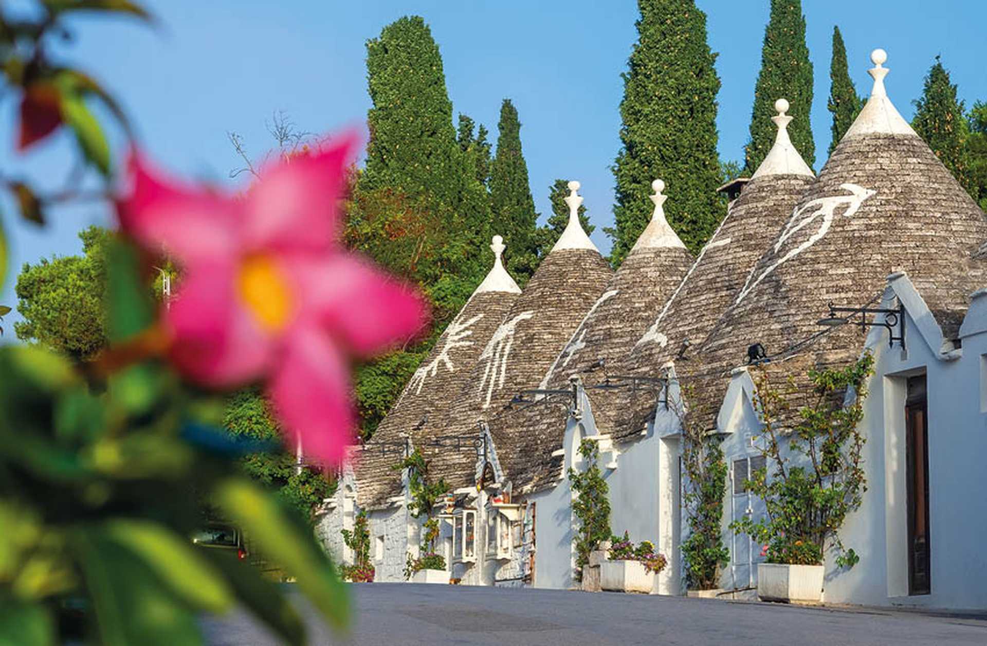 Traditional cone-roofed trulli houses in Alberobello, Puglia