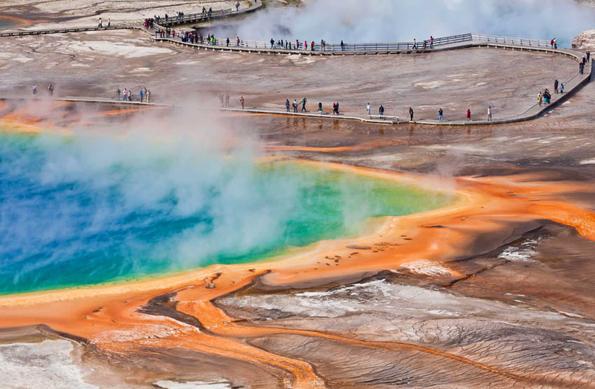 Steam rises from a geothermal pool in Yellowstone National Park, USA