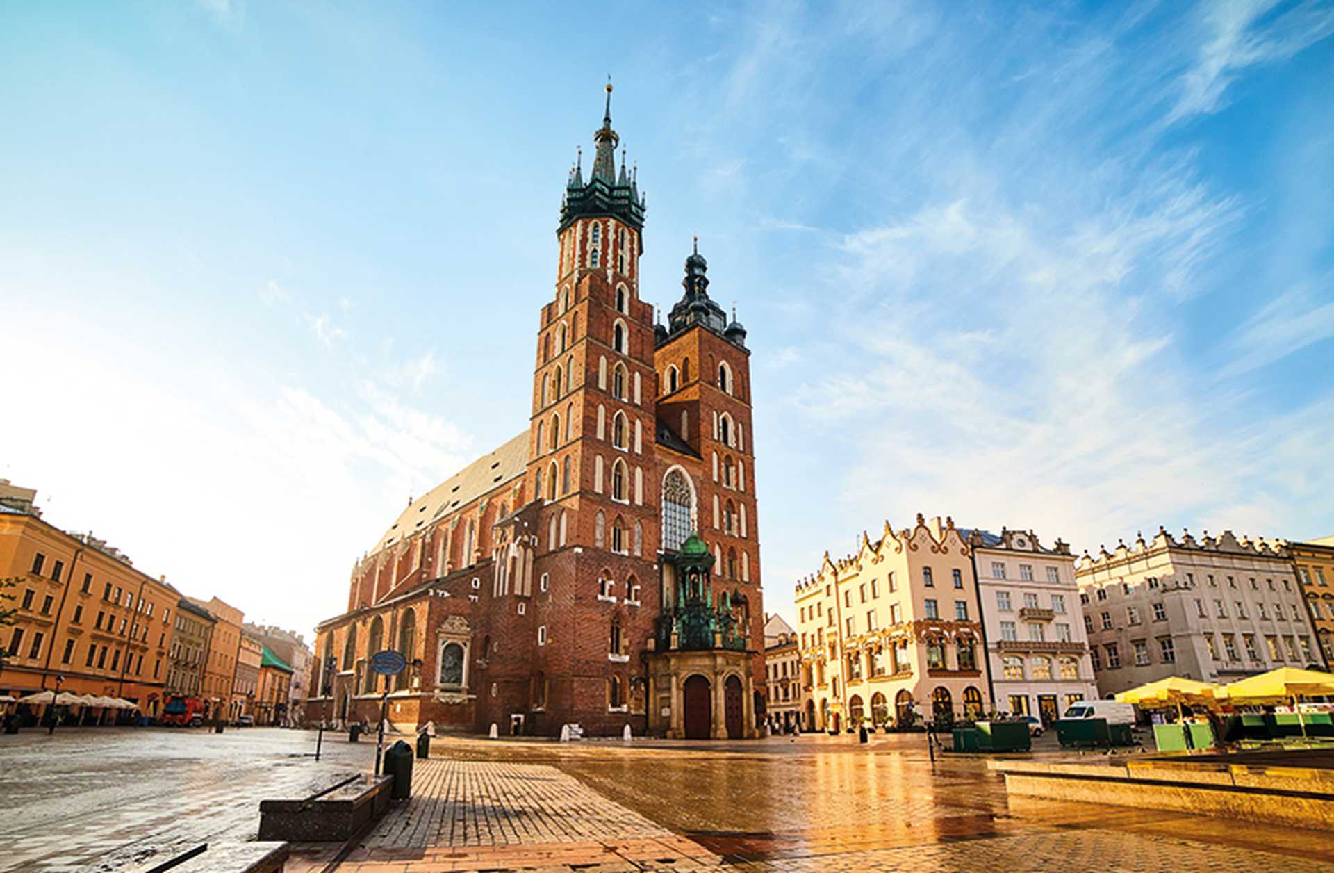 St. Mary's Basilica on Krakow Main Square (Rynek Glowny) at sunrise, Poland