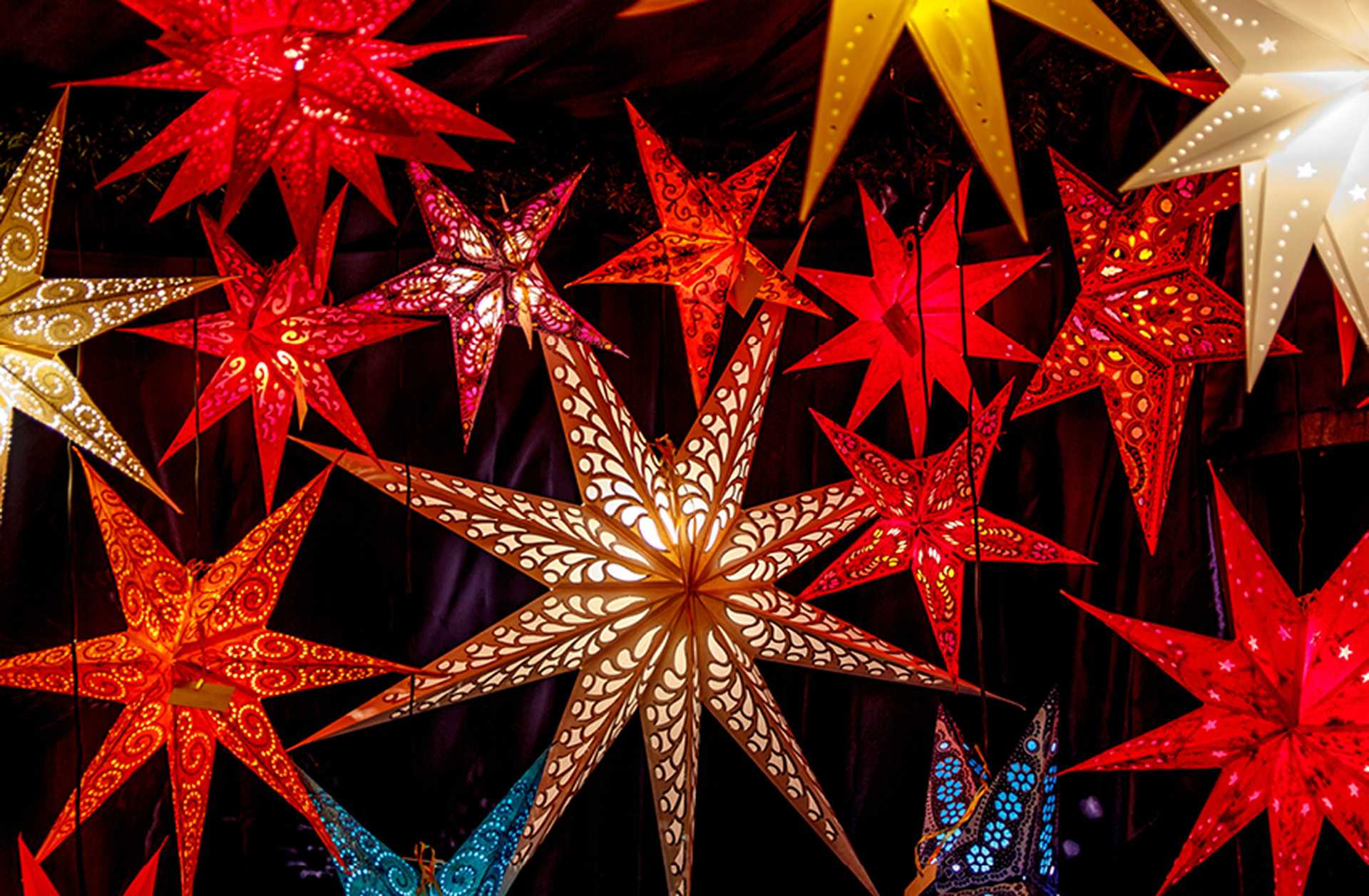 Illuminated stars decorate a Christmas market