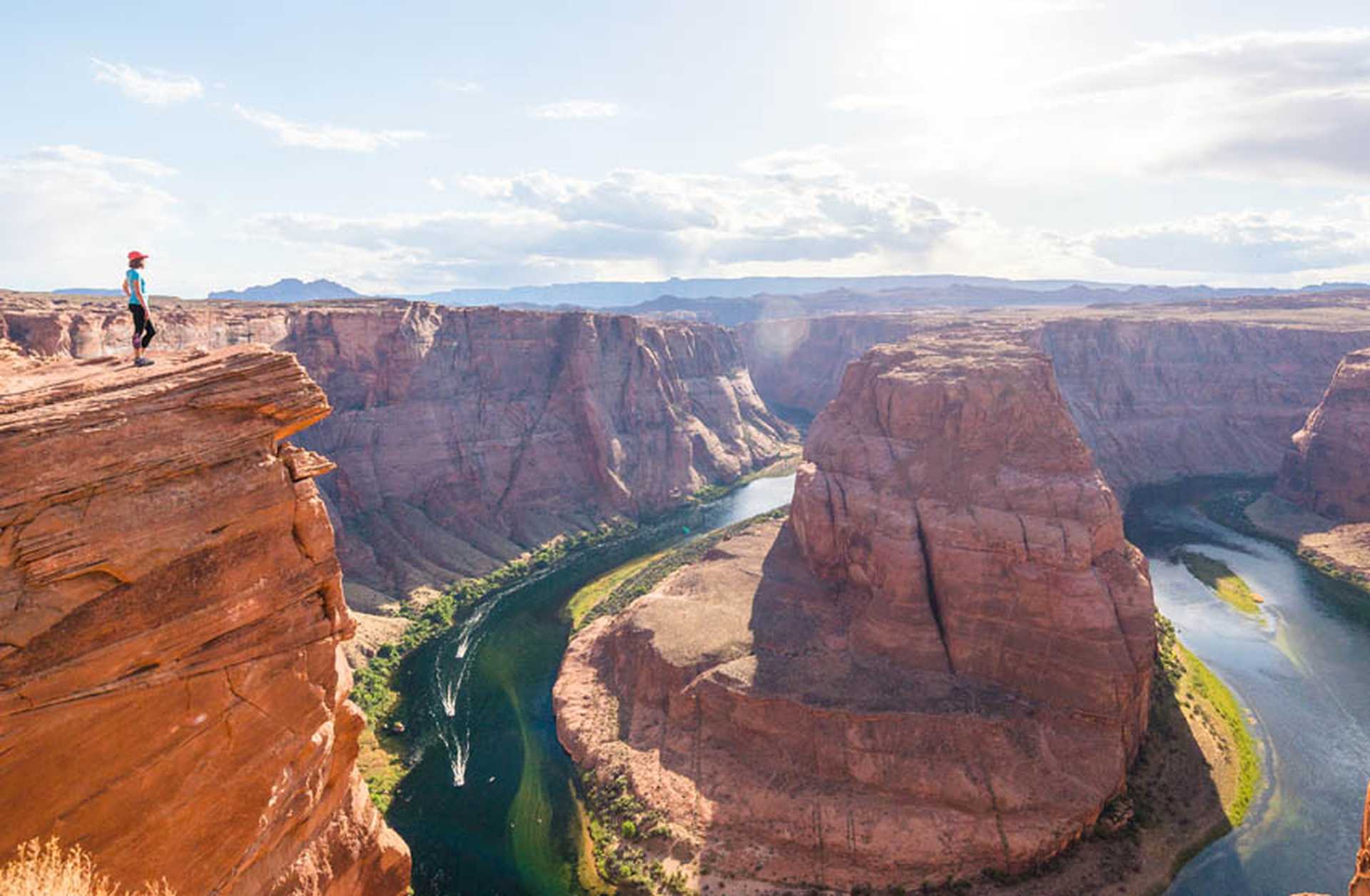 A visitor looks out over Horseshoe Bend, Arizona