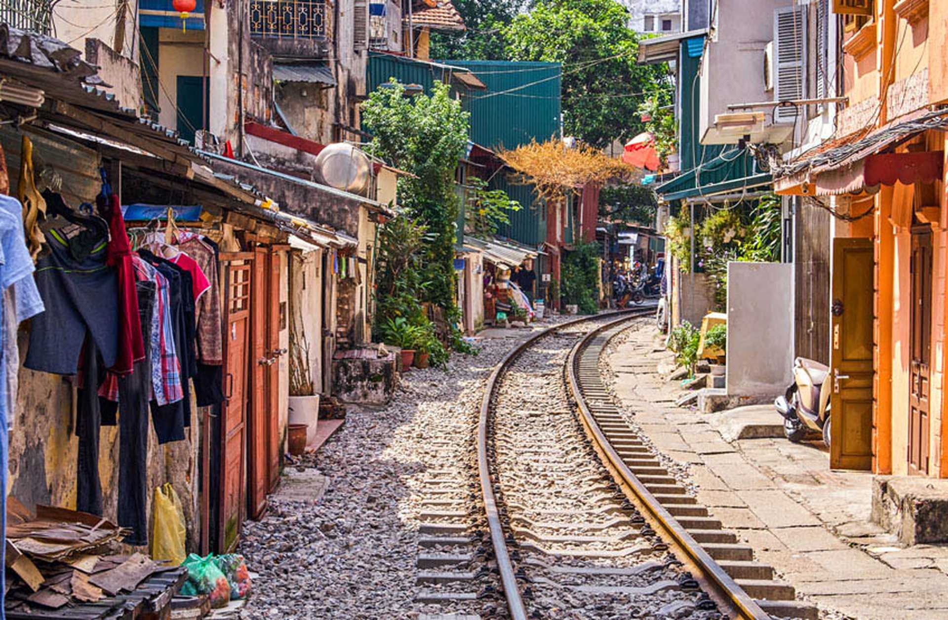 A railway line runs past houses in Hanoi, Vietnam
