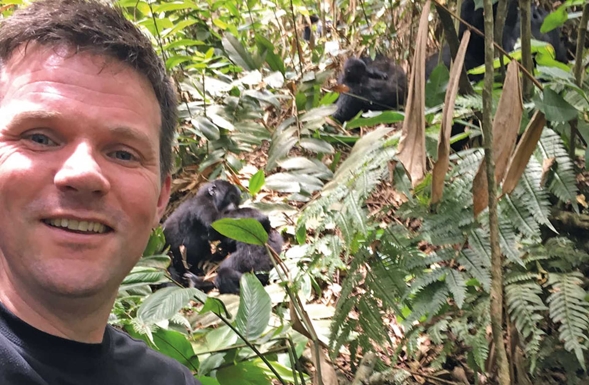 Phil spots gorillas on a mountain trek in Uganda