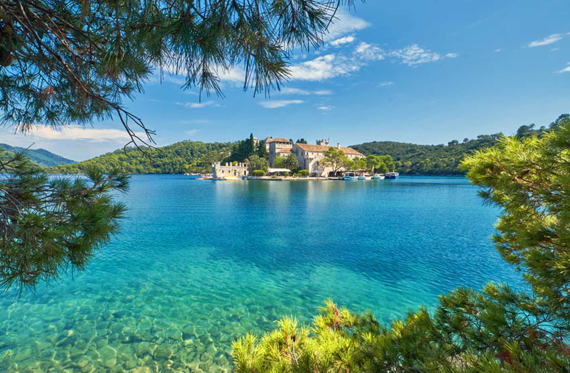 View across clear waters to Saint Mary island inside Mljet National Park in Croatia