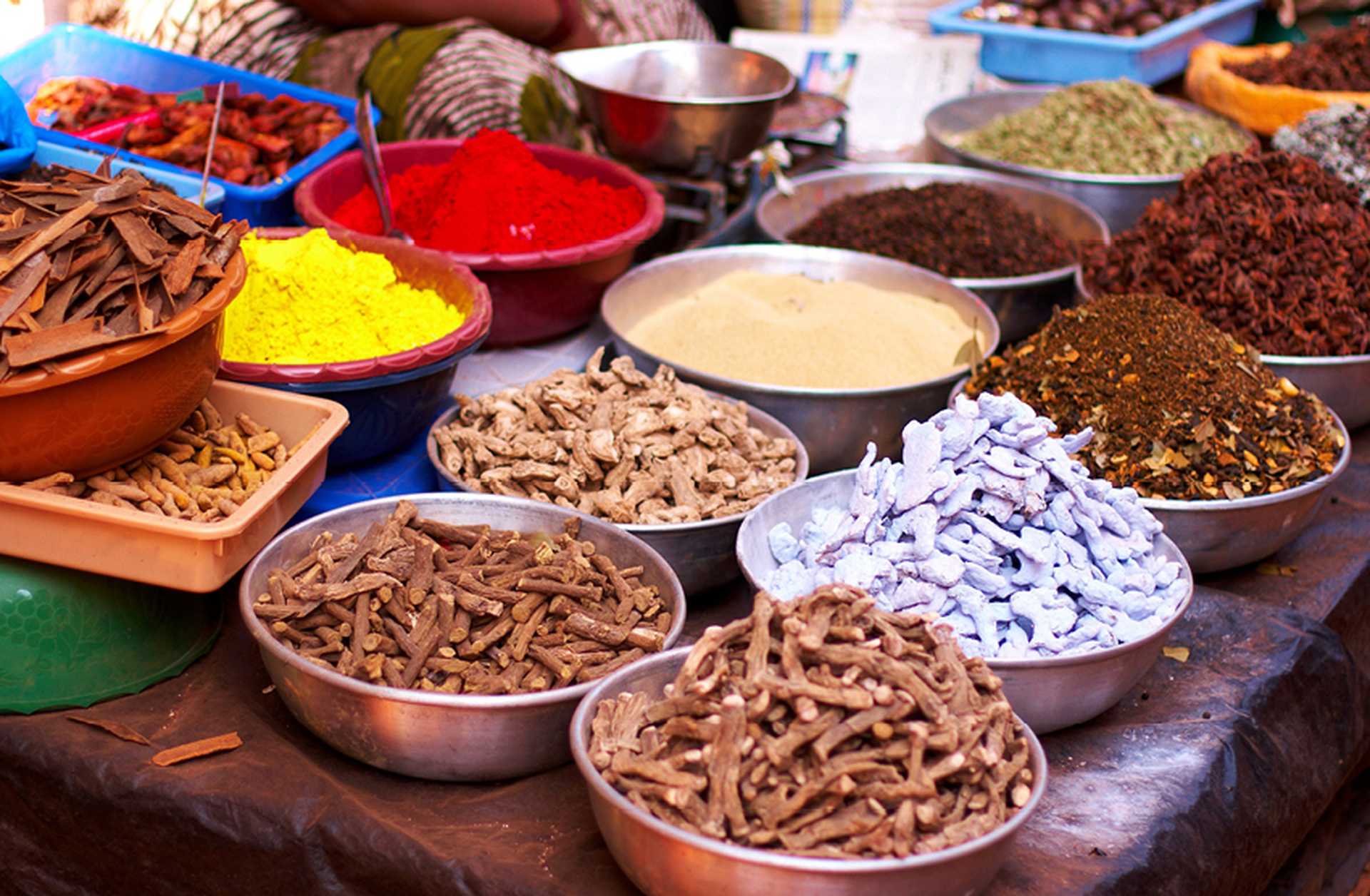 Close-up of spices in silver dishes on a table