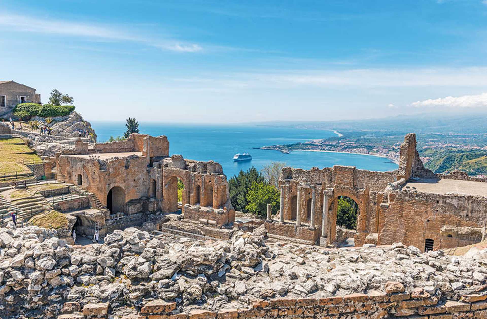The Greco-Roman amphitheatre in Taormina, Sicily, overlooking the Ionian Sea