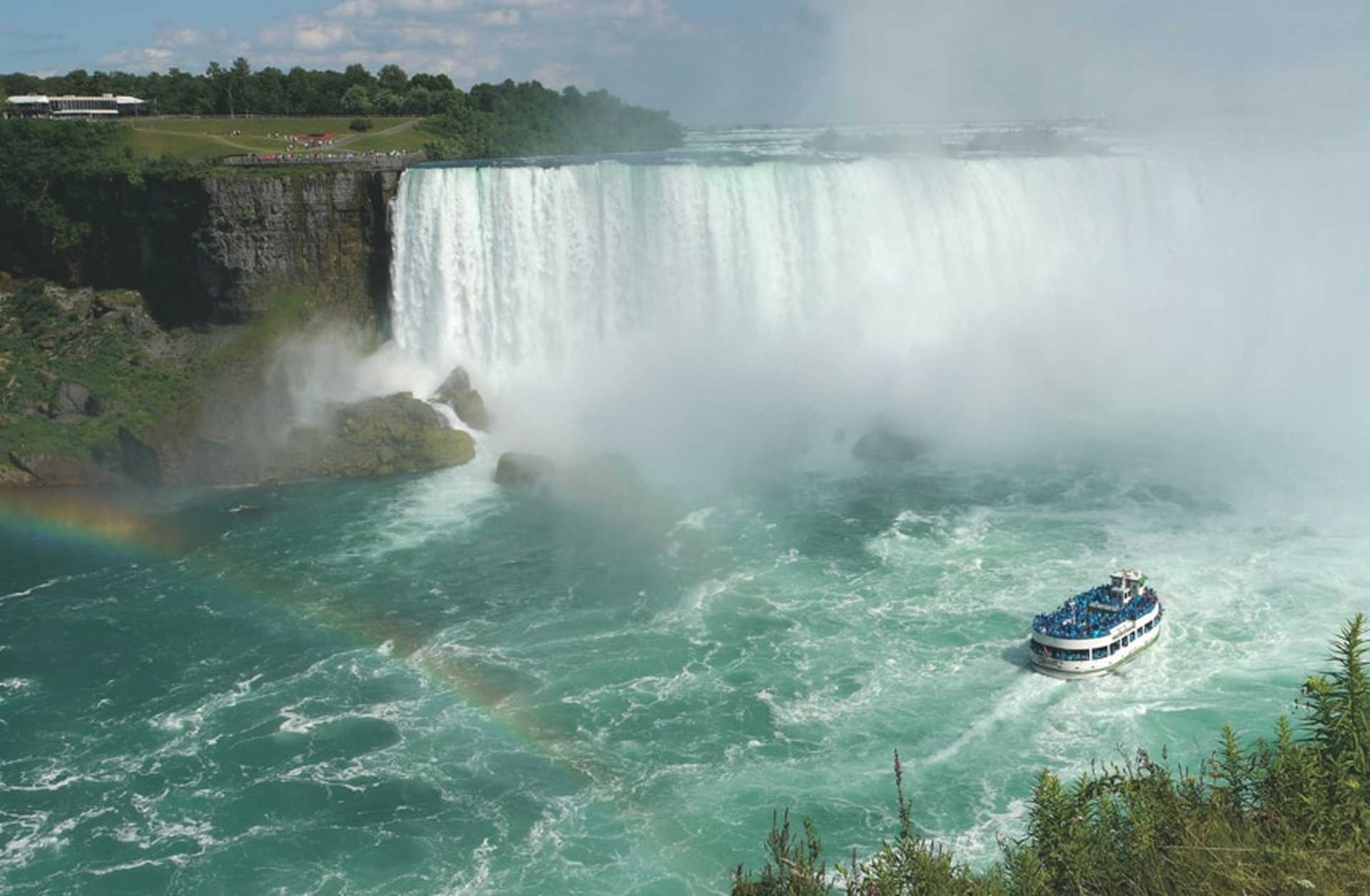 A boat approaches the spray of Niagara Falls