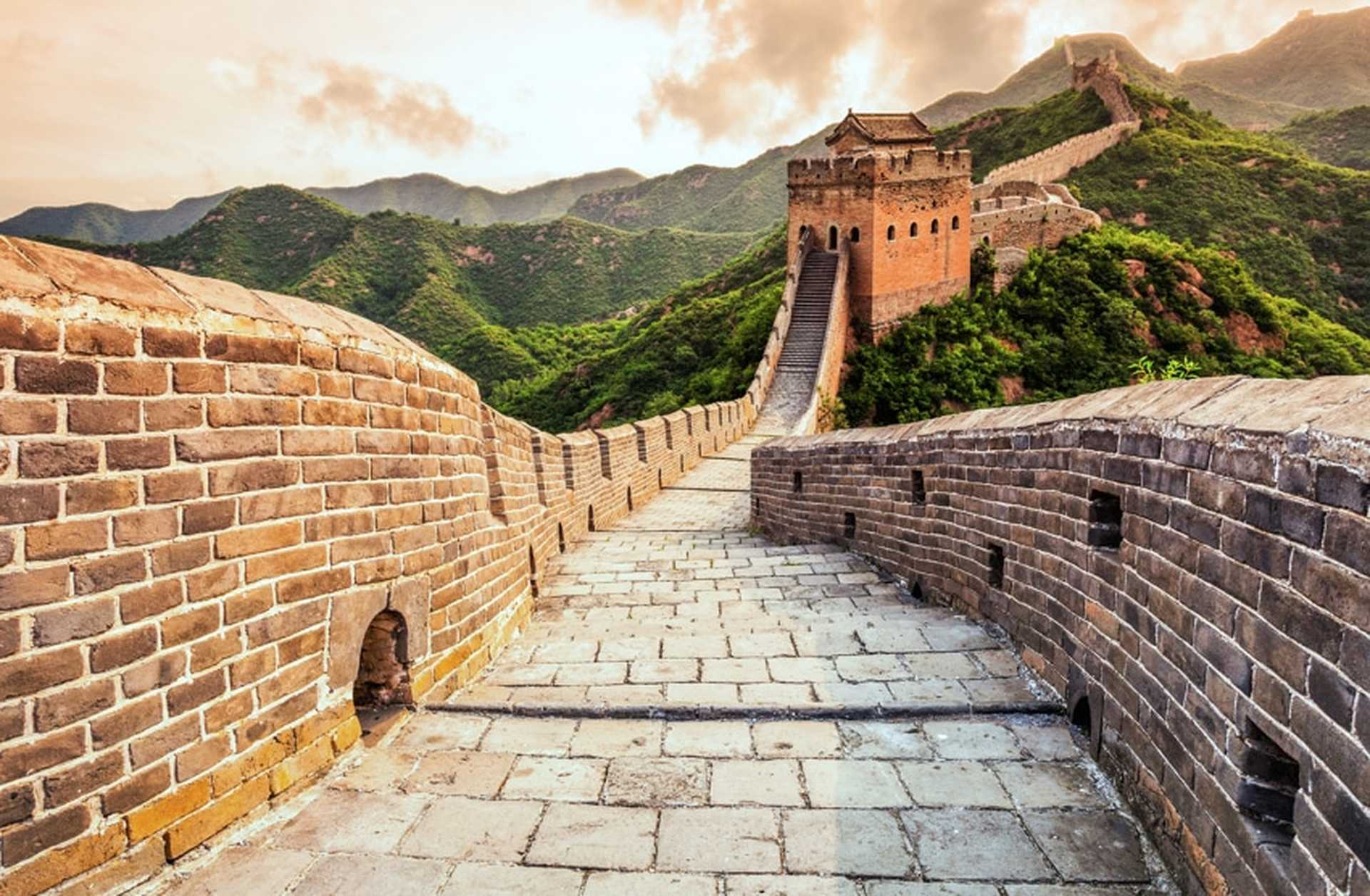 The Great Wall of China snaking across forested hills
