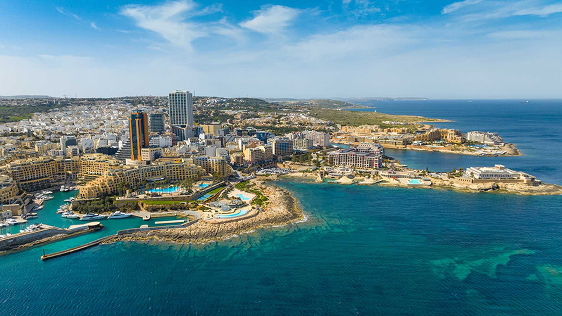St. Julian's city and modern high buildings, hotels. Malta