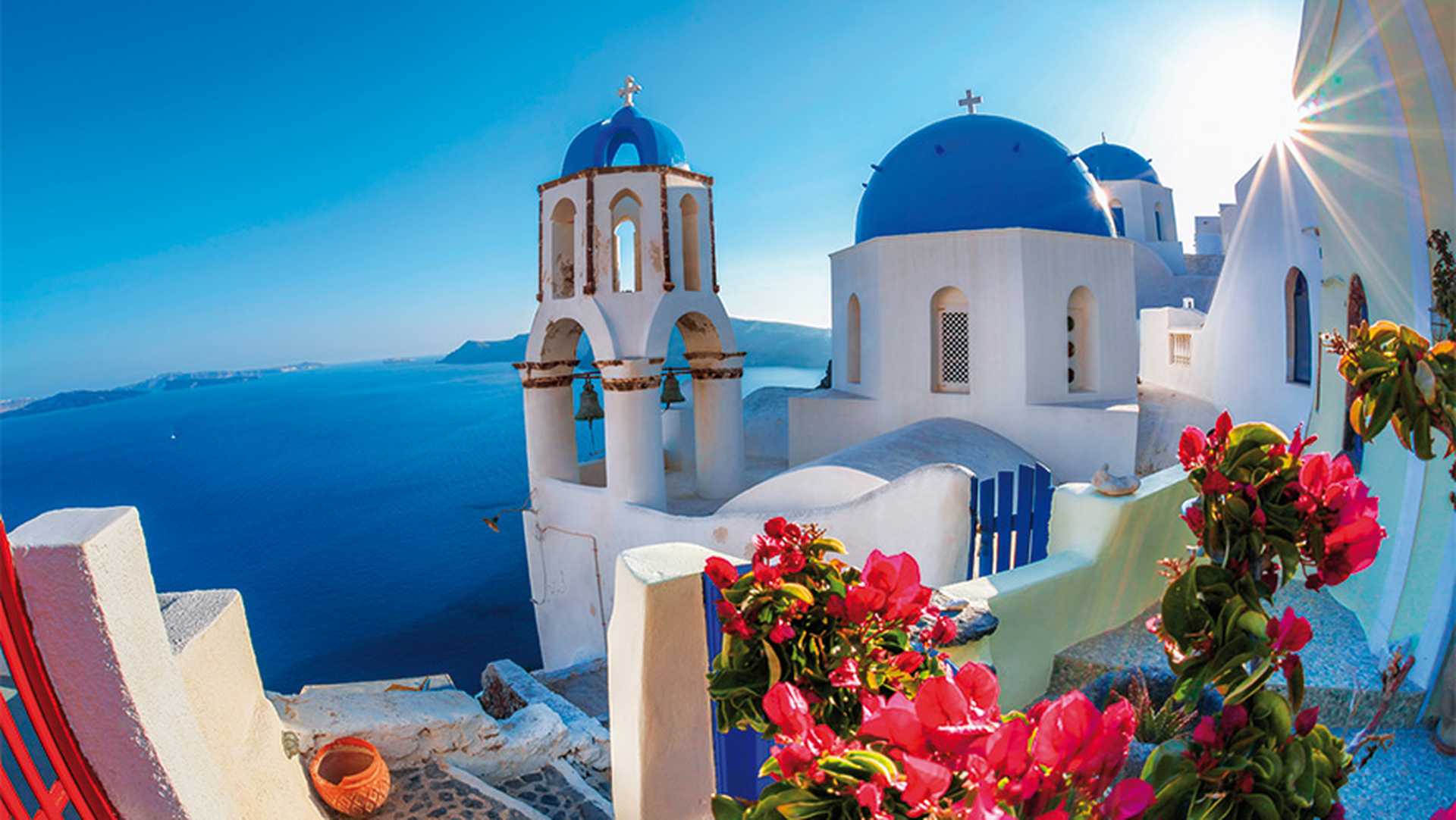 Oia village in Santorini island with famous churches,  Greece