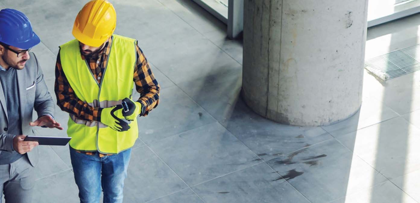 Stock photograph of two men at a construction site