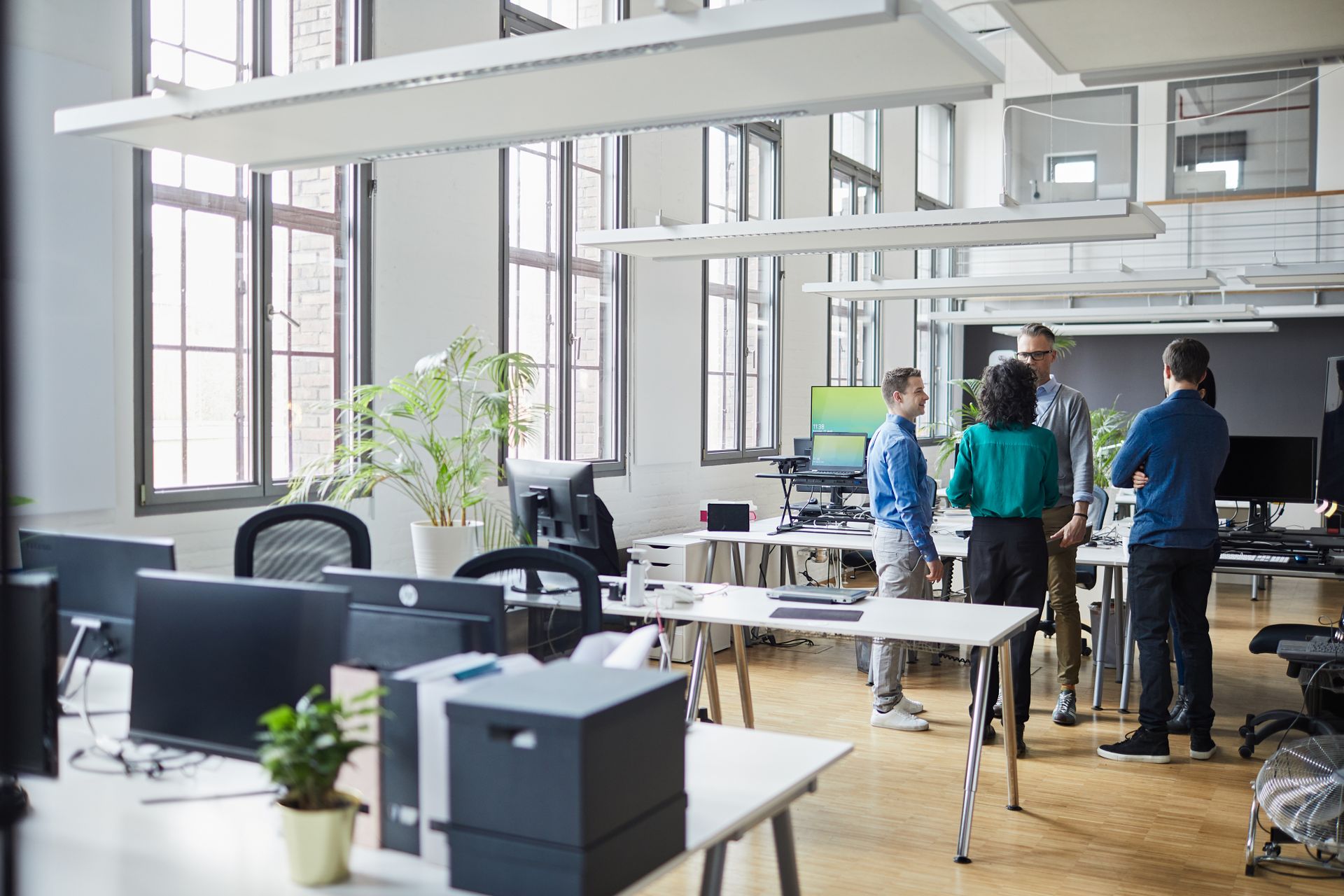 Picture of people in a group in an office setting