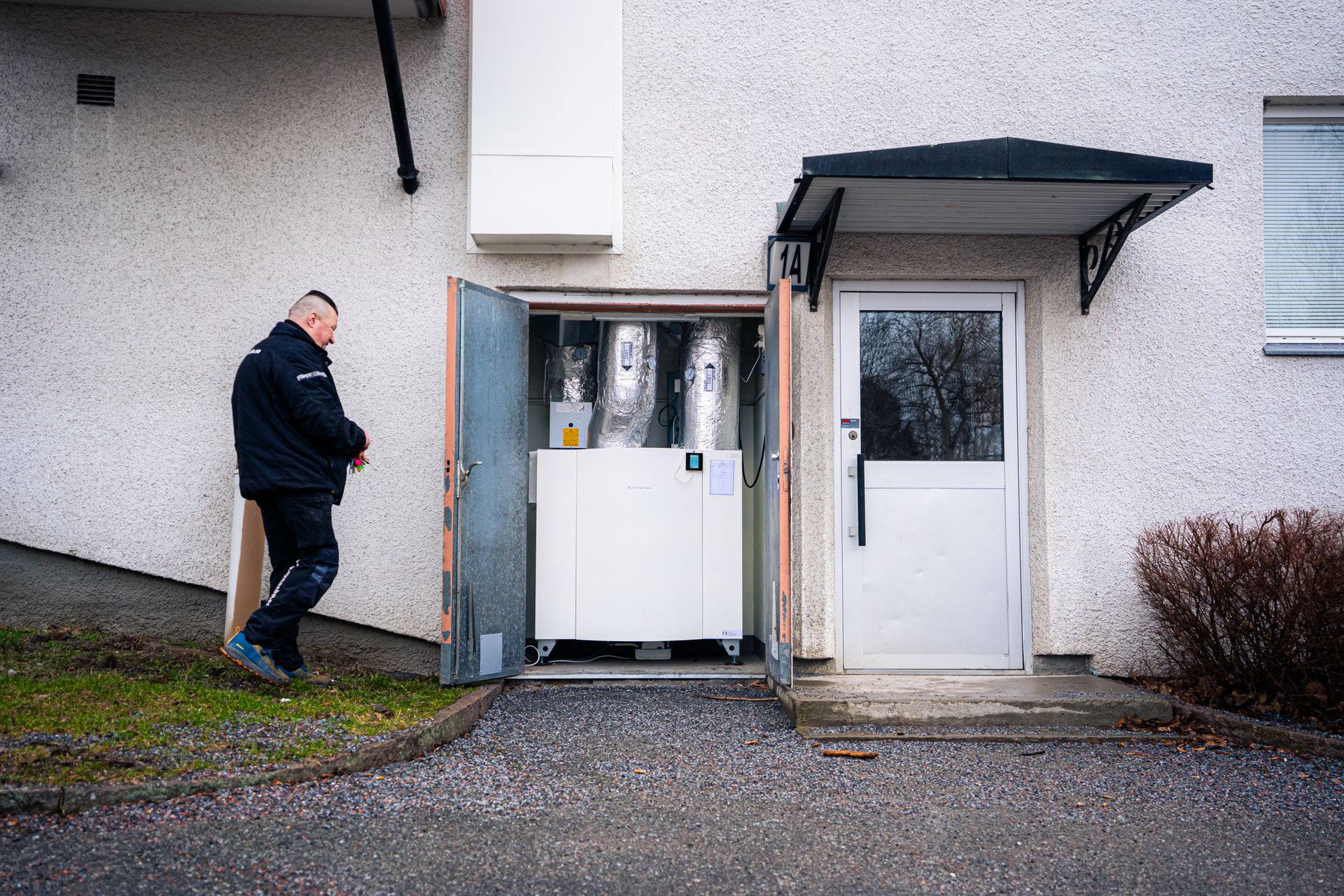 Photograph of a man and a Systemair product in a residential