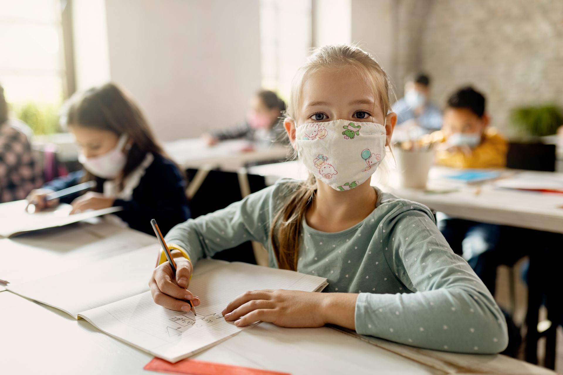 Kid in classroom with mask