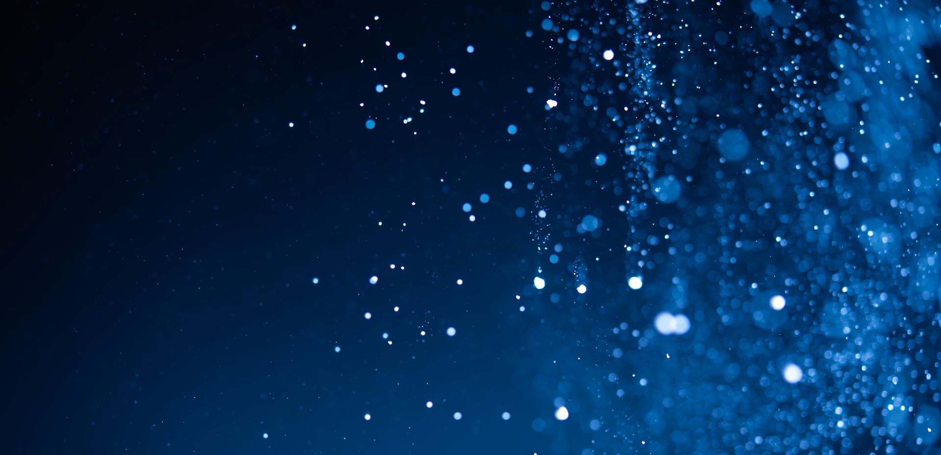 Stock image of a blue background with sparkle
