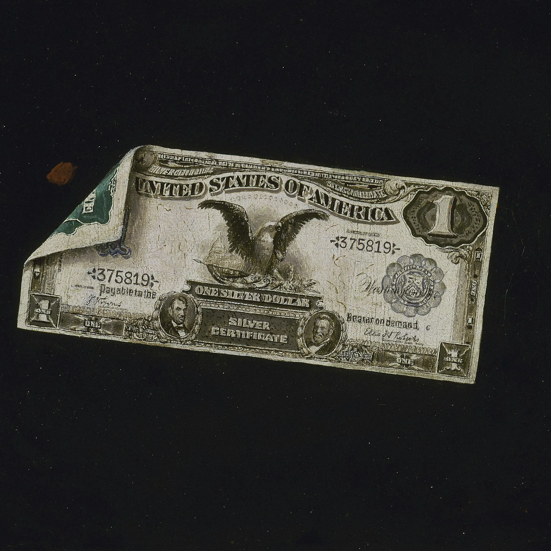 A worn, vintage U.S. silver certificate with an eagle design and a visible crease, set against a dark background.