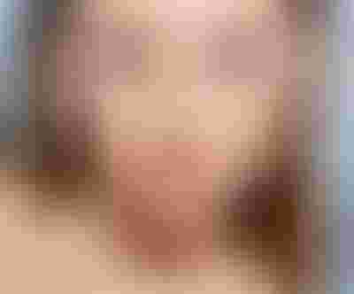 gold candy charm with red heart stone