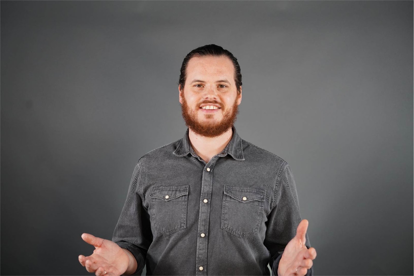Guy presenting and smiling