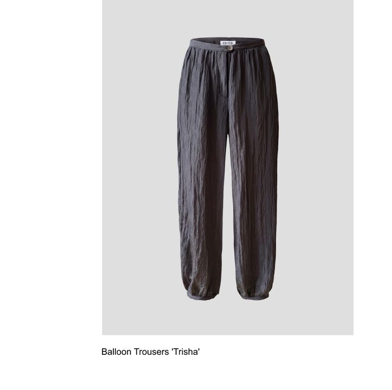 Dark gray balloon trousers named 'Trisha' displayed on a light gray background.