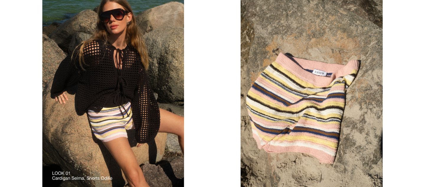 A woman in a black crochet cardigan and striped shorts sits on rocks. Next to her, a close-up of the colorful striped shorts is displayed on a rock.