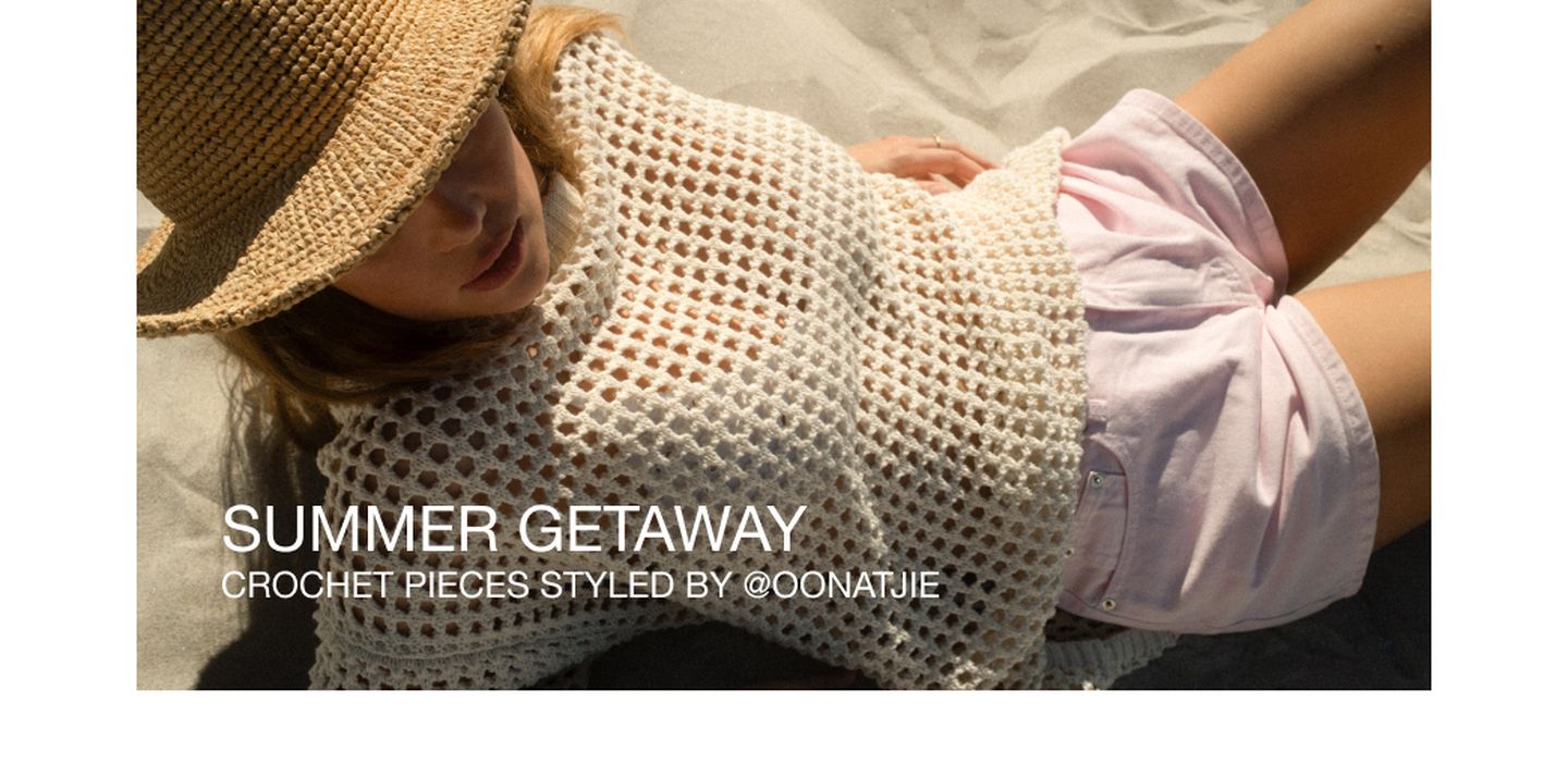 Woman in a sun hat and crochet top, relaxing on sand in pink shorts. Text reads: "Summer Getaway Crochet Pieces Styled by @oonatjie."