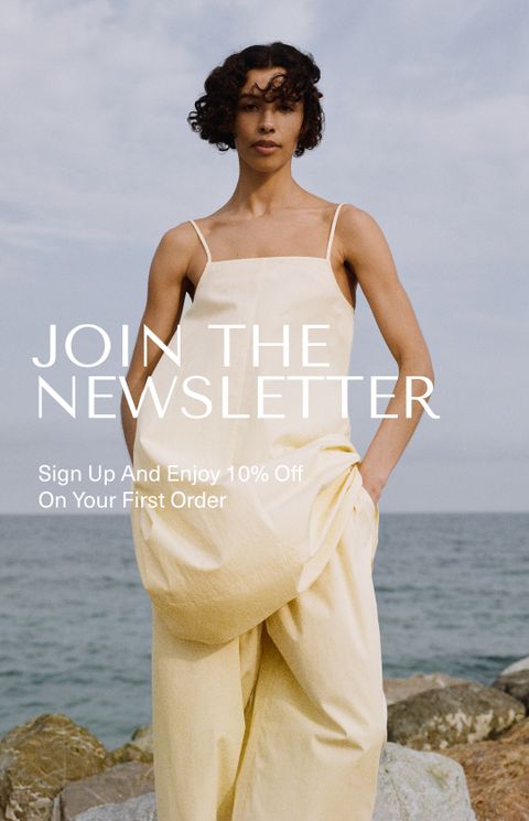 Woman in a yellow dress by the sea, with text: "Join the Newsletter. Sign Up And Enjoy 10% Off On Your First Order."