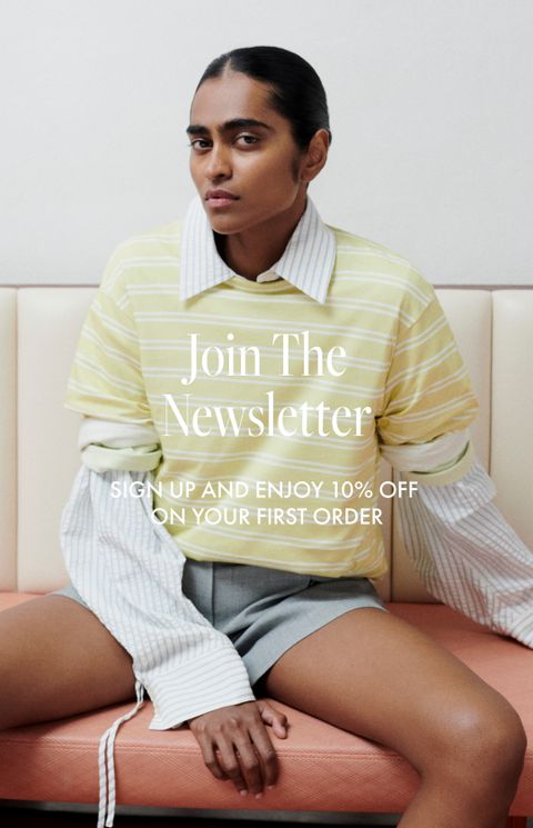 Person in layered striped shirts and shorts sits on a cushioned bench; text reads "Join The Newsletter" with a 10% sign-up offer.