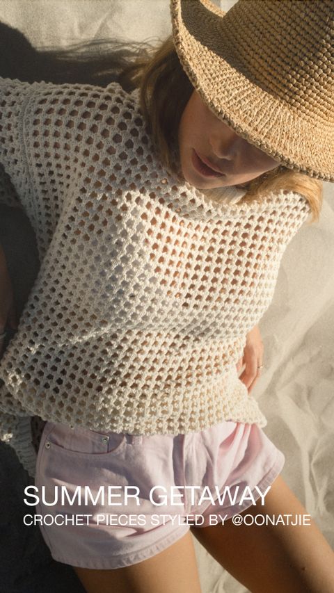 Woman on sand wearing a straw hat, white crochet top, and pink shorts. Text reads "Summer Getaway, Crochet Pieces Styled By @oonatjie."