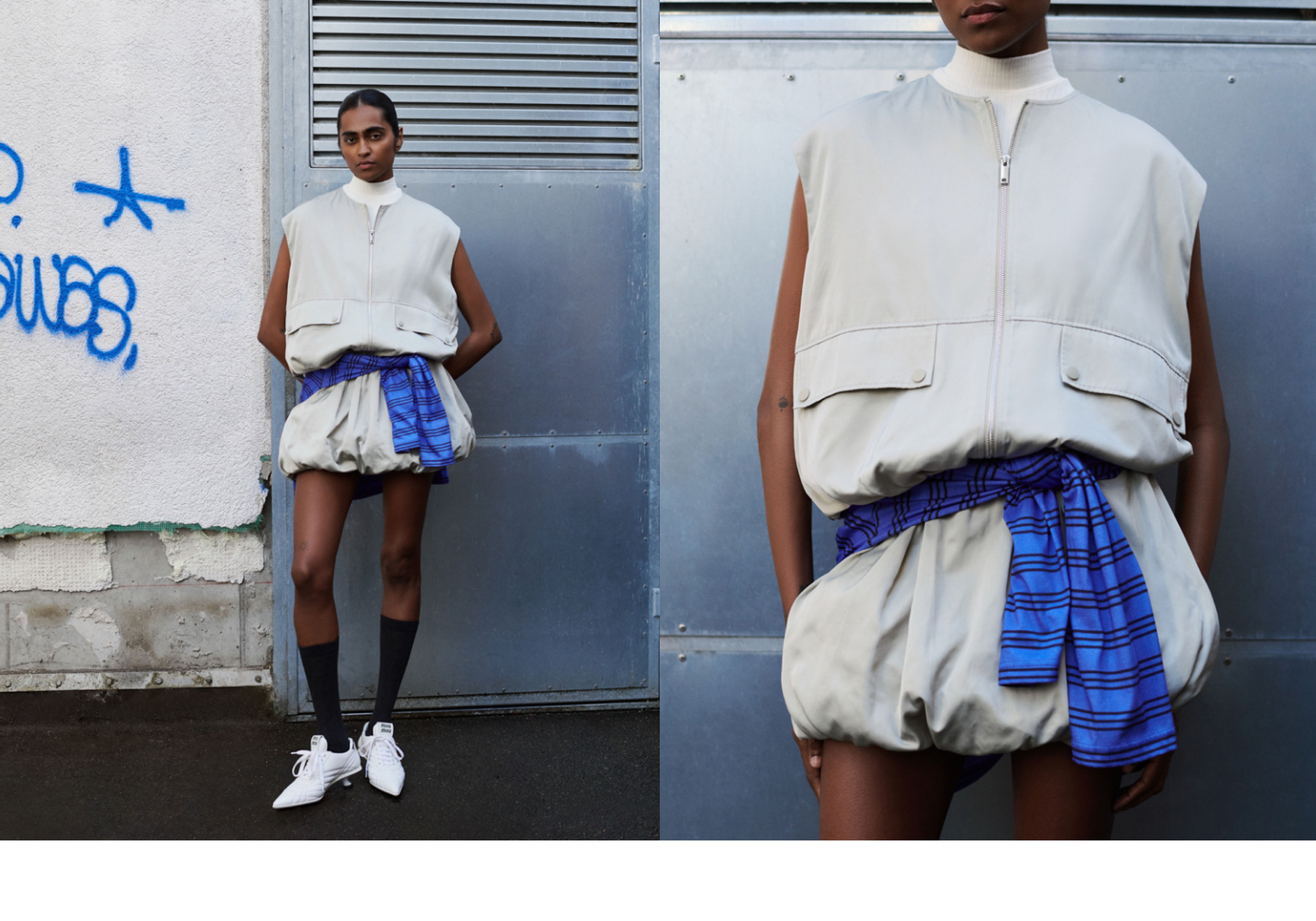 Person in a light gray sleeveless outfit with a blue plaid shirt tied at the waist, wearing white sneakers and black knee-high socks.