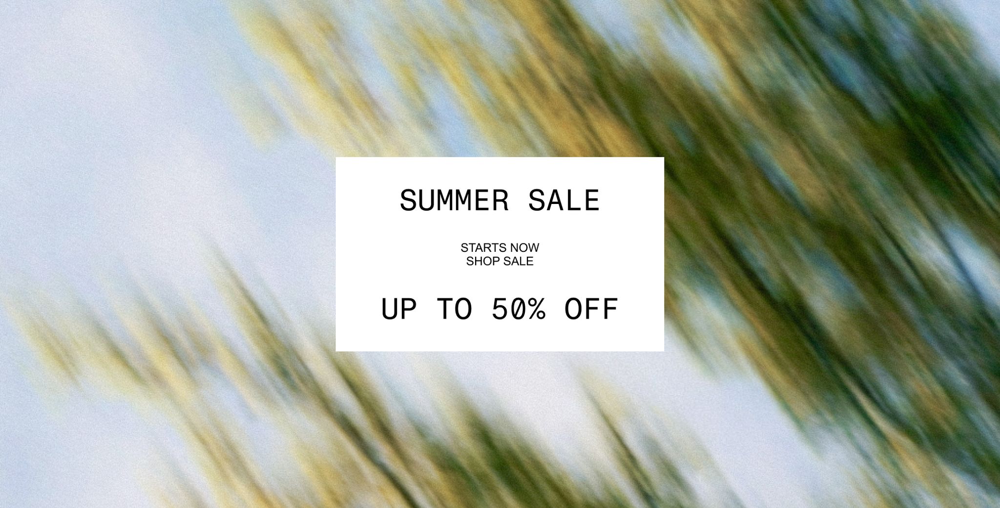 Blurred background with a white box displaying "Summer Sale, Up to 50% Off" in bold letters.