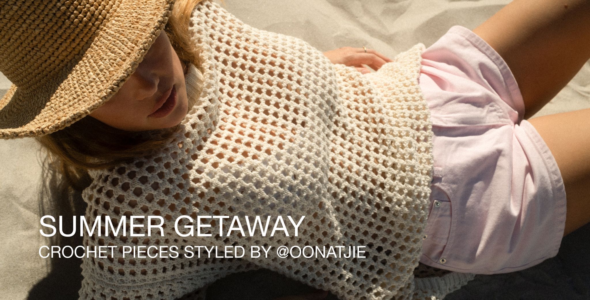Woman in sun hat and crochet top reclining on sand, with text "Summer Getaway - Crochet Pieces Styled by @oonatjie."