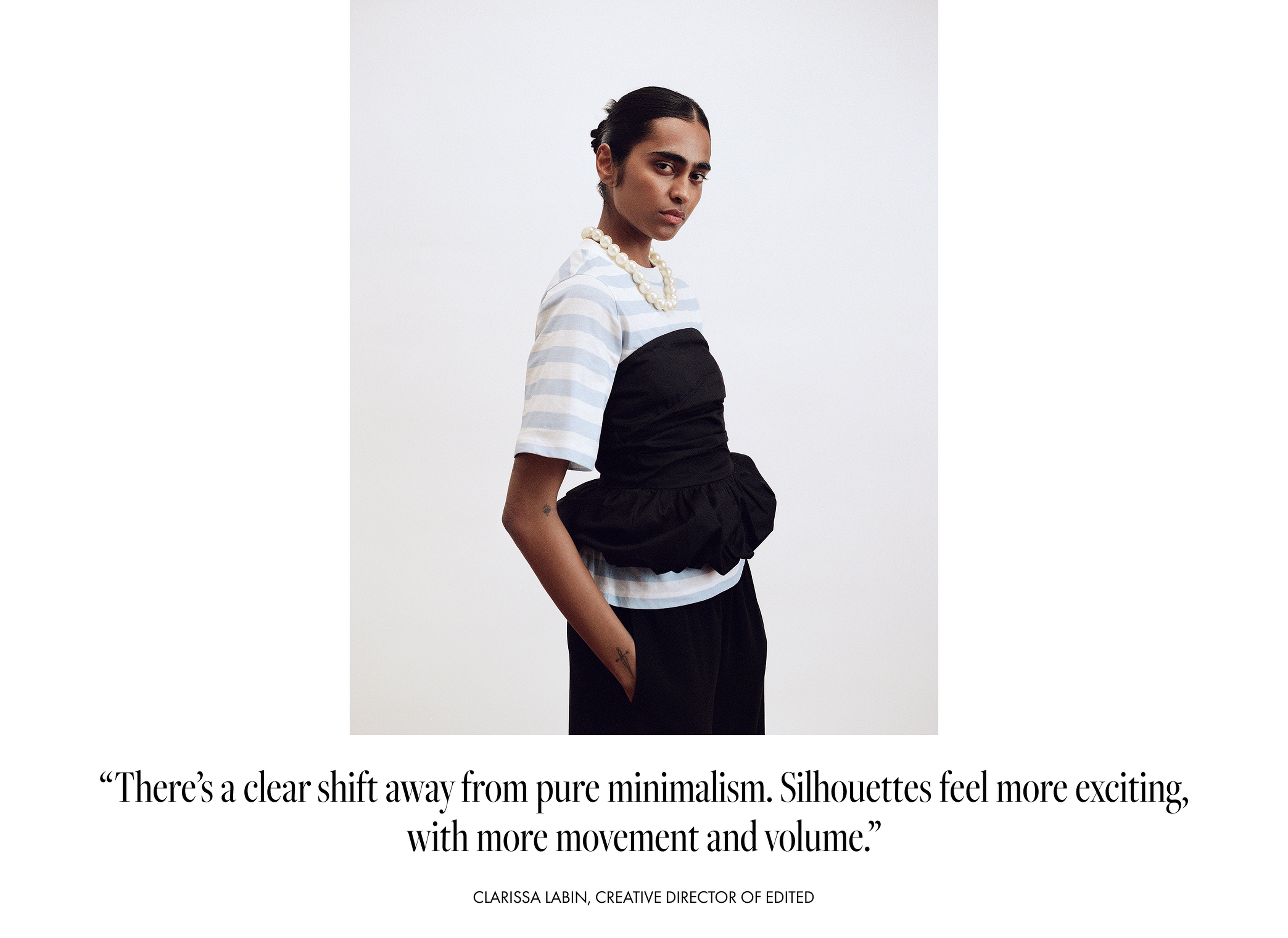 A person poses in a striped shirt with a black structured overlay, wearing a pearl necklace. Quote below on fashion silhouettes by Clarissa Labin.