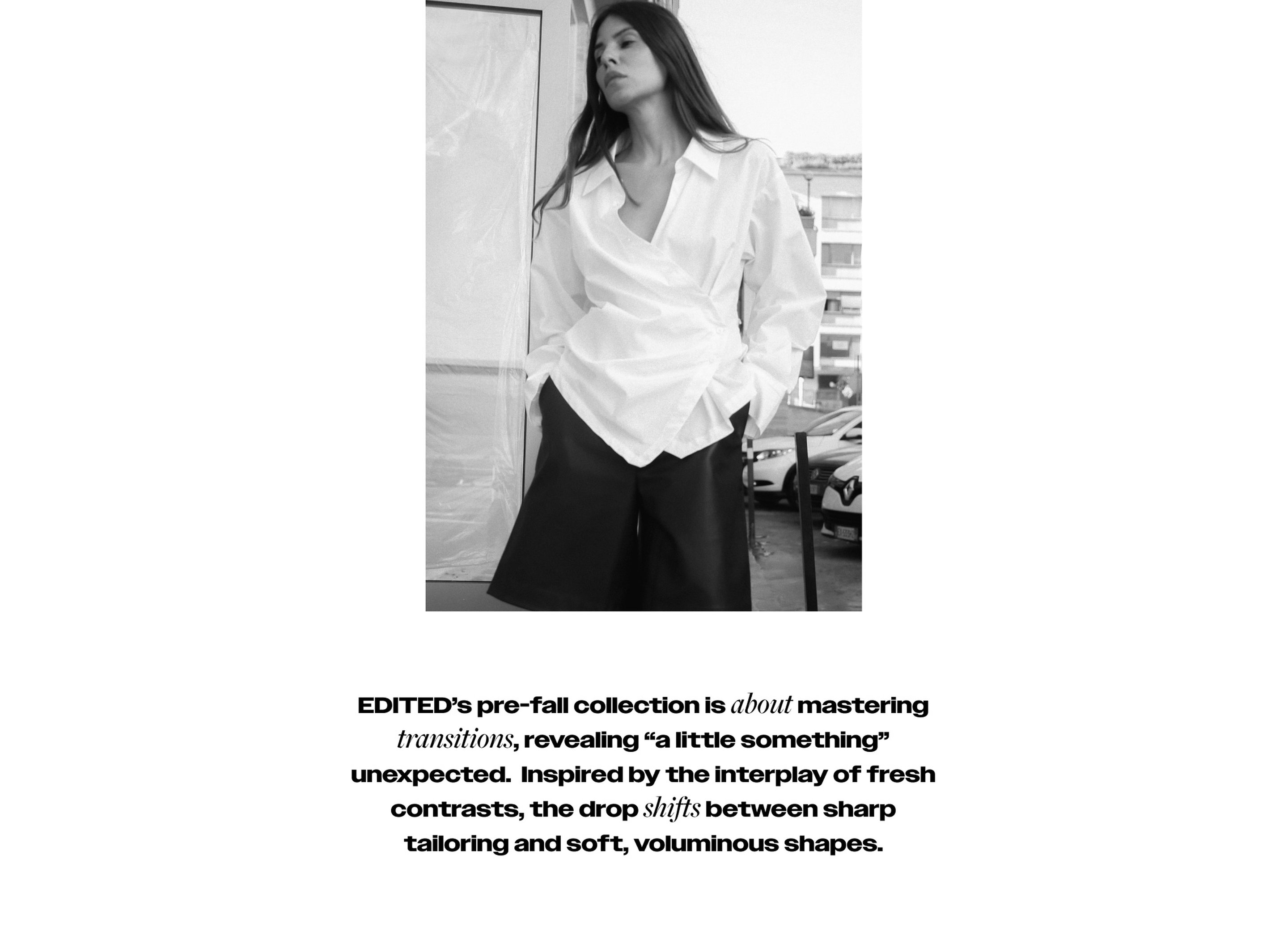 Woman in a white blouse and black shorts stands against a blurred cityscape. Text about EDITED's pre-fall collection below.