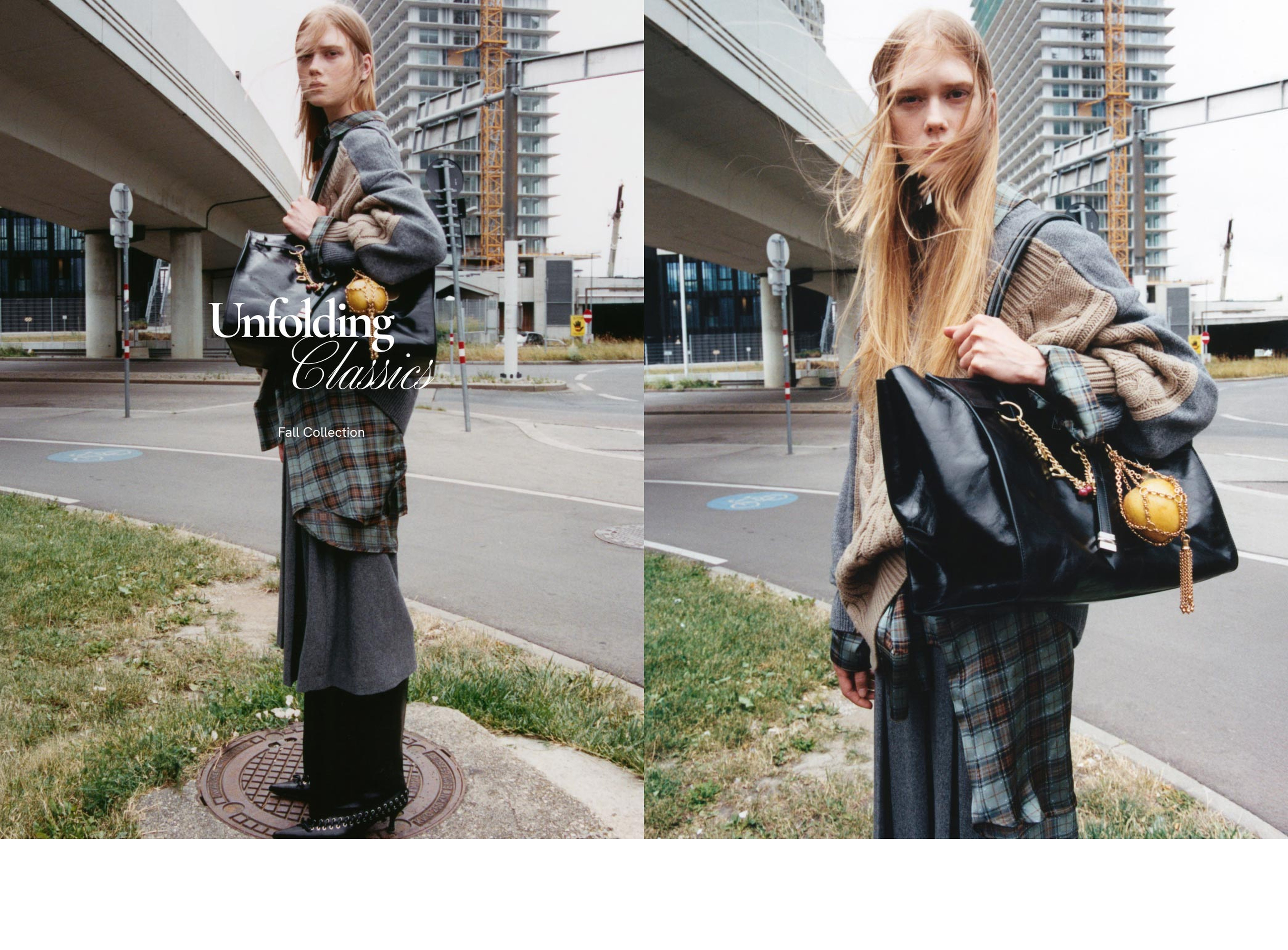 A model in layered gray and plaid clothing poses outdoors with a large black bag, under an overpass, with tall buildings in the background.