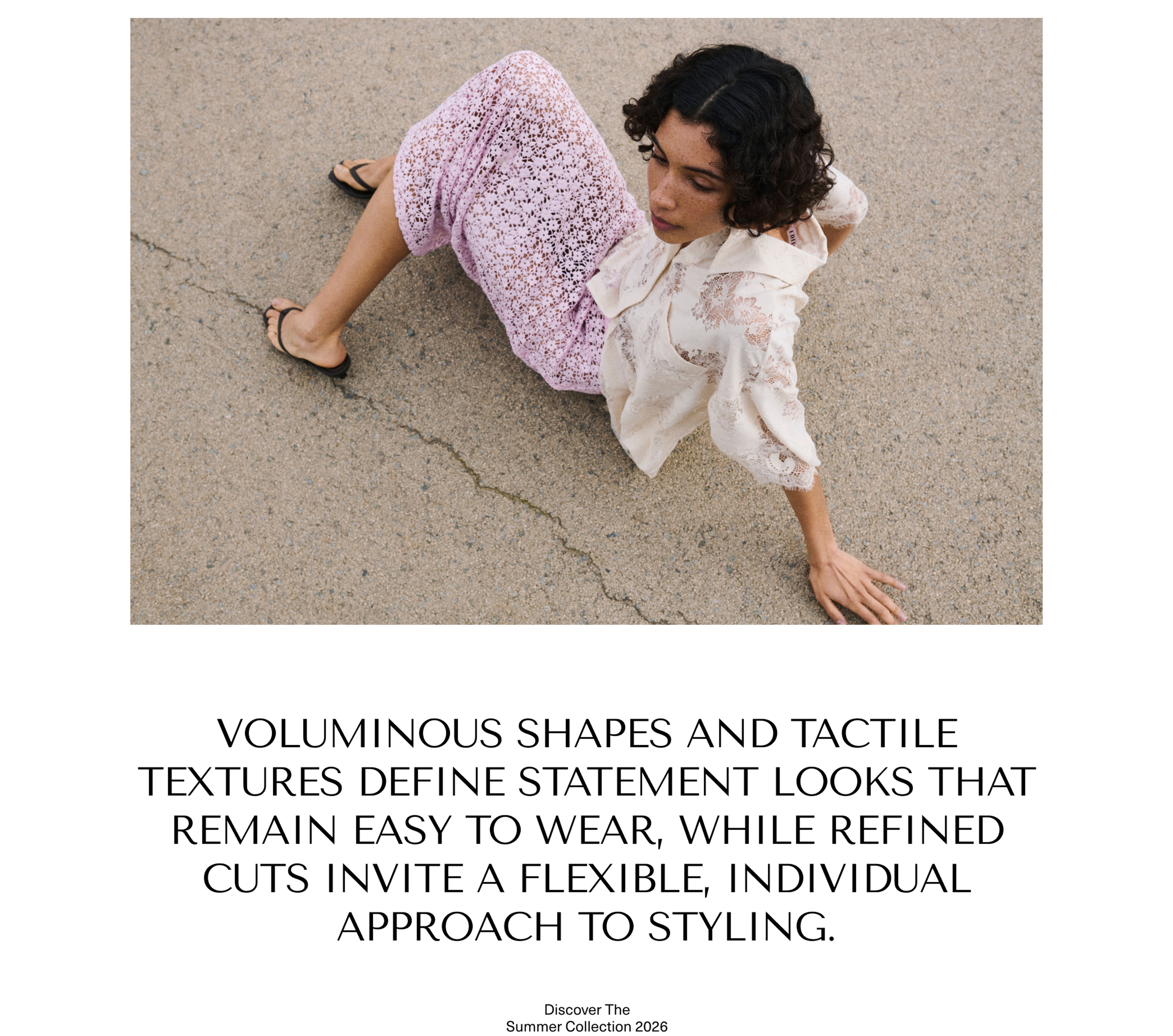 Person sitting on pavement wearing a patterned dress and sandals, with text promoting a fashion collection focused on voluminous shapes and textures.