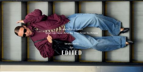 A person in sunglasses and a maroon jacket lies on an escalator, with text promoting a fashion launch by "larabsmnn" for "EDITED."