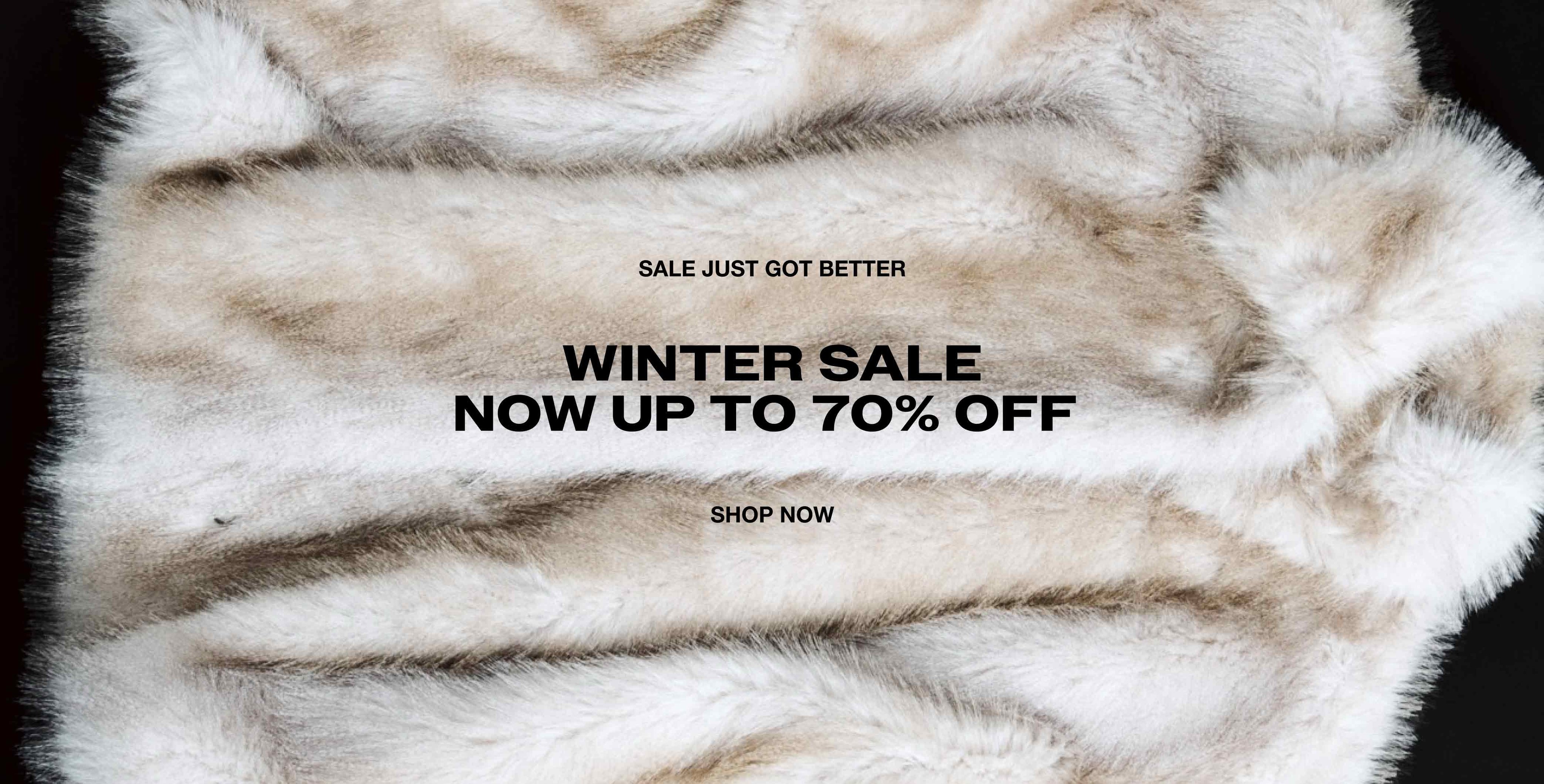 Furry white and beige background with text: "Winter Sale Now Up to 70% Off. Shop Now."