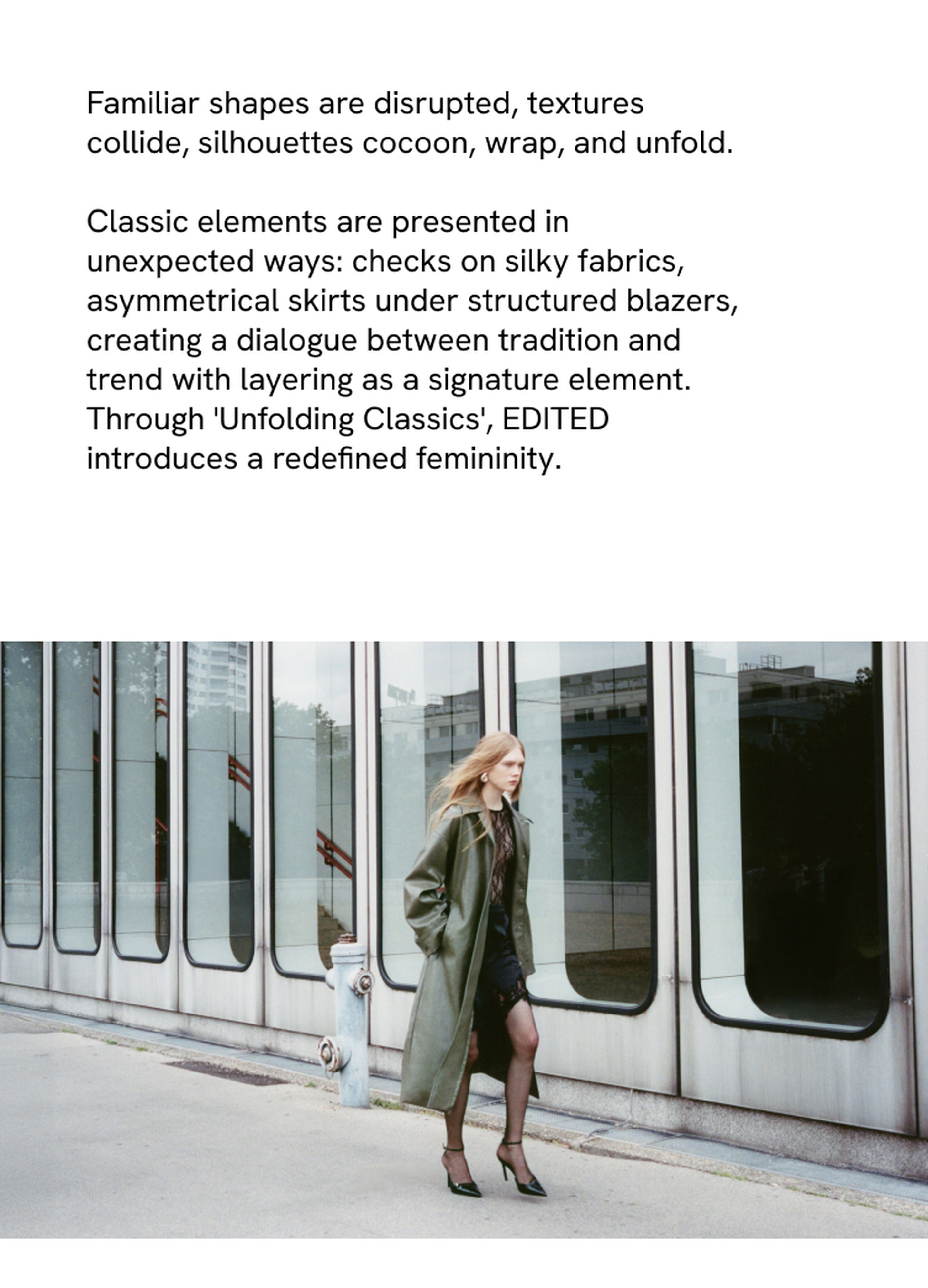 A woman in a green coat and heels walks past modern glass windows. Text above discusses fashion elements and trends.