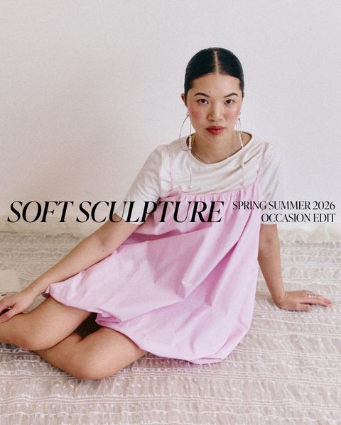 Woman in pink dress sitting on patterned fabric; text reads "Soft Sculpture Spring Summer 2026 Occasion Edit."