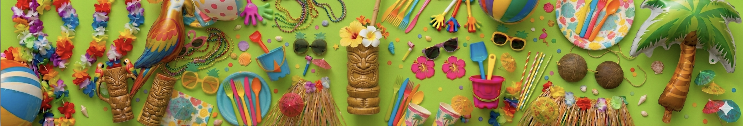A variety of tropical party items, including leis, sunglasses, tiki mugs, straws, and inflatable decor, are arranged on a bright green background.