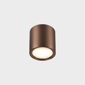 OCULUS Deckenaufbauleuchte in Kupfer auf grauem Hintergrund.