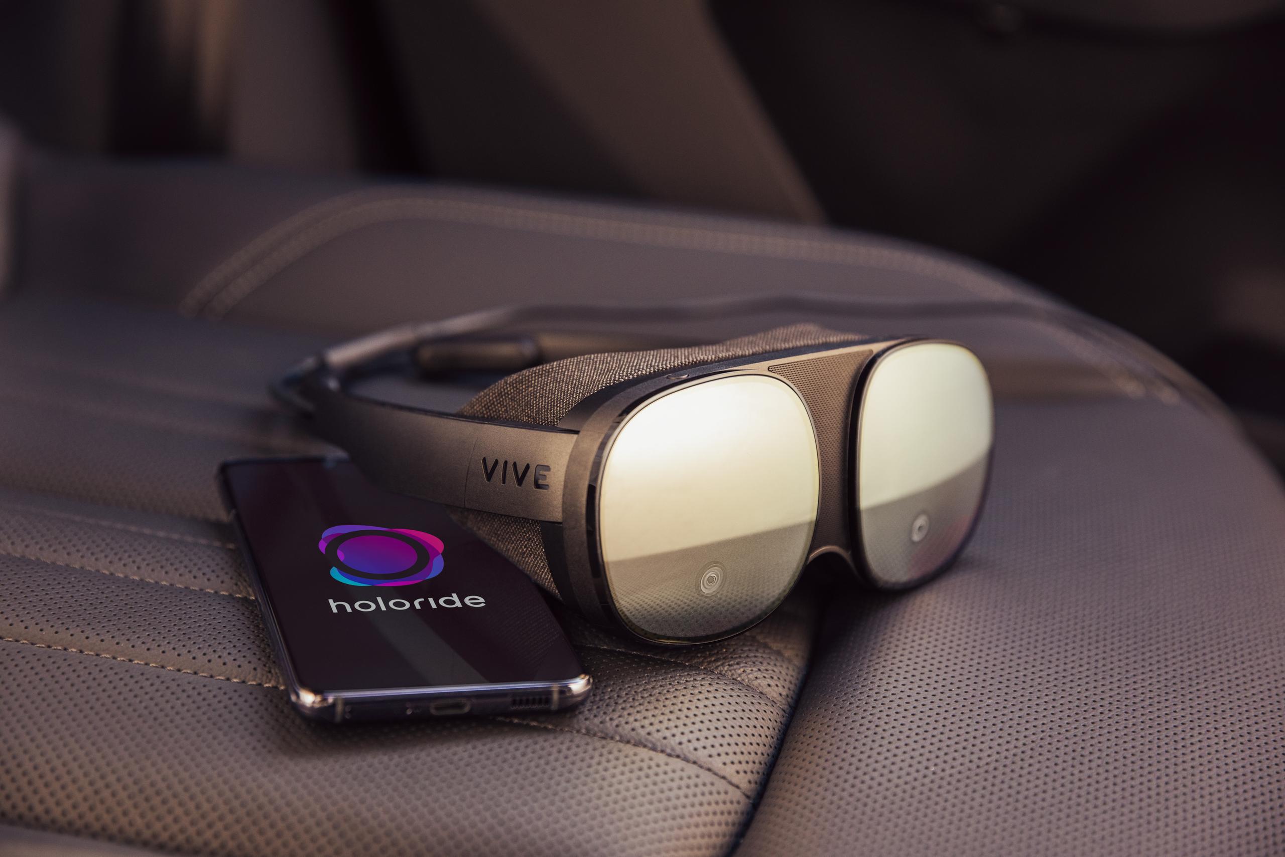 HTC Vive Flow headset with mobile phone laying on the backseat of the car