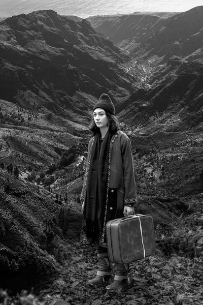 Person in black & white standing