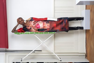 woman lying on ironing board