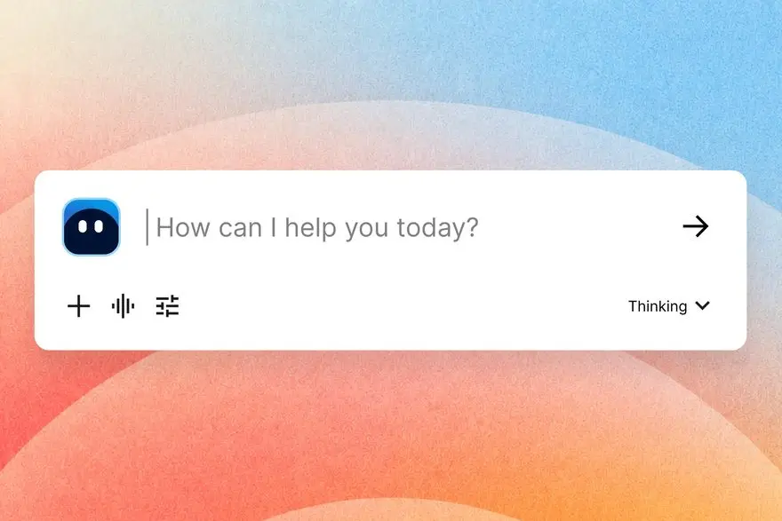A chat input box on a pastel gradient